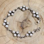Pulsera Perlas Escudo Adaptable